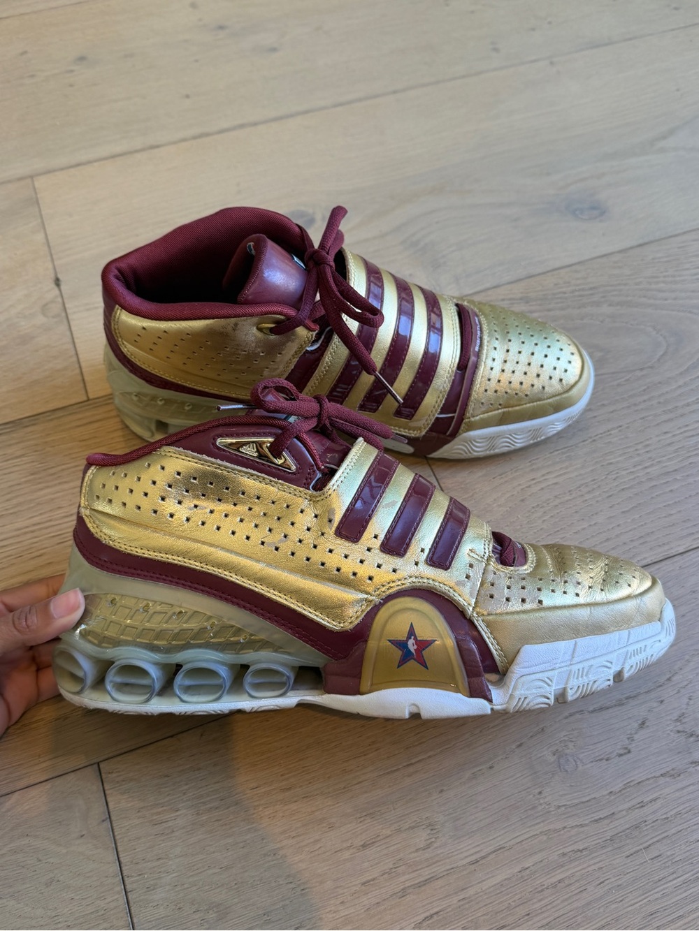 Adidas All Star Phoenix 2001 sneakers in gold with maroon stripes